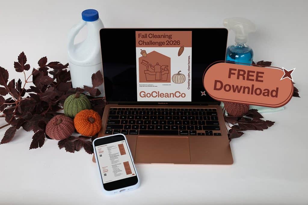 FCC Free 3 - House Work Laptop screen shows a Fall Cleaning Challenge 2026 poster with GoCleanCo branding amid autumn leaves, a pumpkin, and fall decor; a phone nearby displays a document.