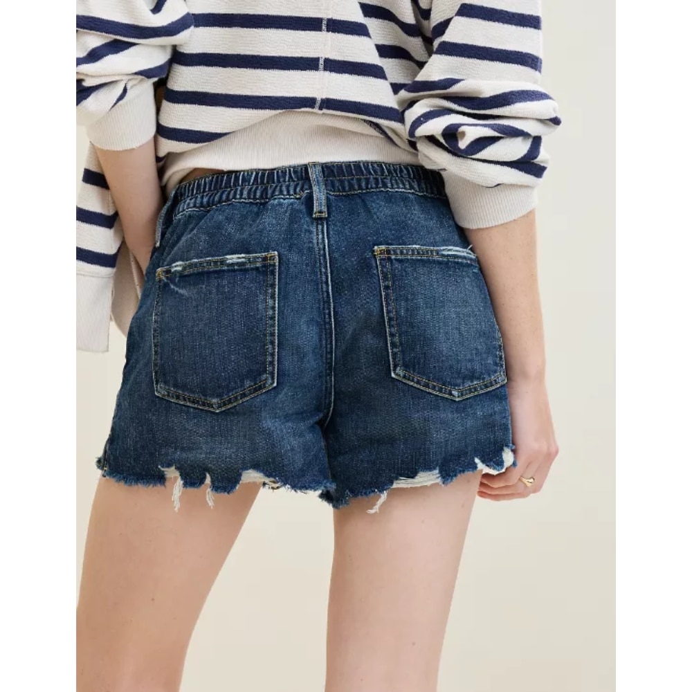 A woman in denim shorts viewed from behind