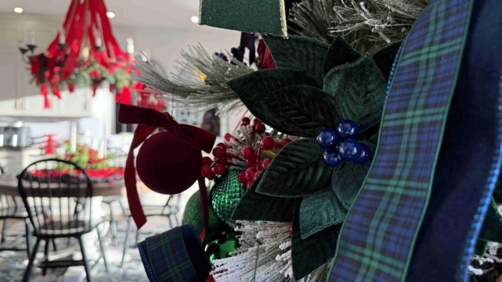 10DE5FAF-6946-4714-8C2C-42576EF45C1C - House Work A flocked Christmas tree with Tartan plaid ribbons and velvet balls.