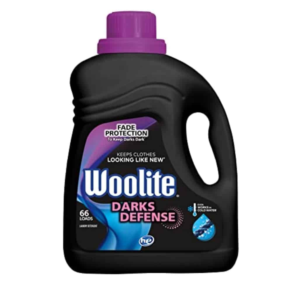 Bottle of Woolite Darks Defense liquid laundry detergent with a purple cap for dark clothes