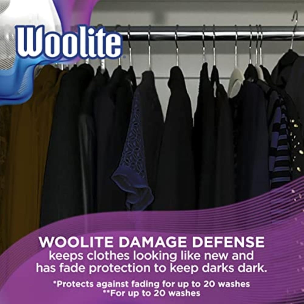 Woolite Damage Defense advertisement over a clothing rack with dark garments, promoting keeping clothes looking new and fade protection for darks.