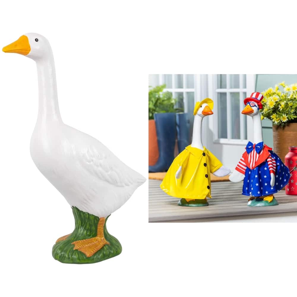 Decorative white duck statue with an orange beak on a green base, shown beside two smaller dressed-duck figurines in yellow and patriotic outfits (garden ornaments).