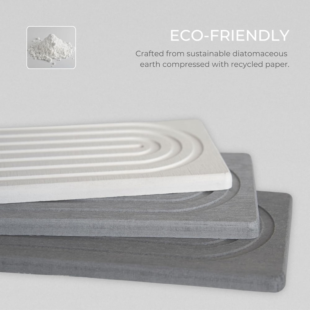 Eco-friendly stacked panels made from diatomaceous earth compressed with recycled paper, shown in white and gray tones with branding.