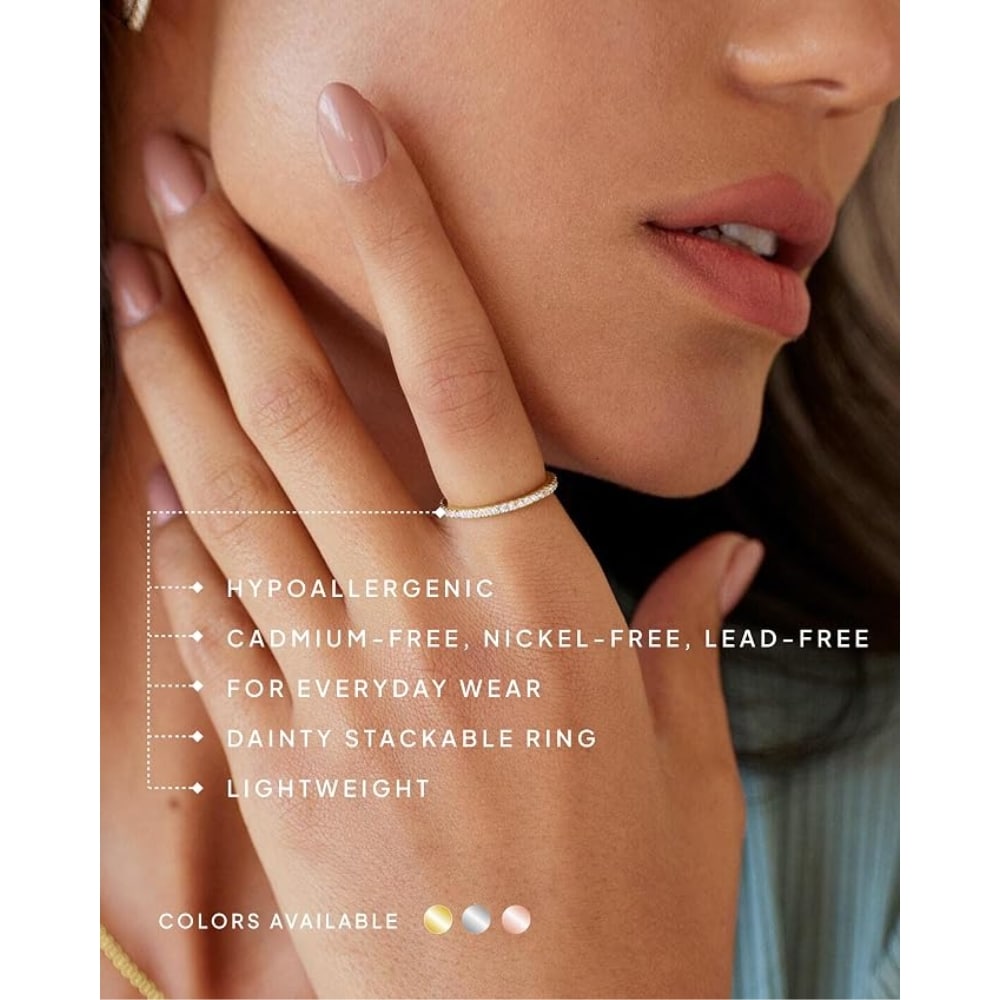 Close-up of a woman's hand wearing a delicate diamond stackable ring, with overlay text about hypoallergenic, cadmium-free, nickel-free, lead-free materials.