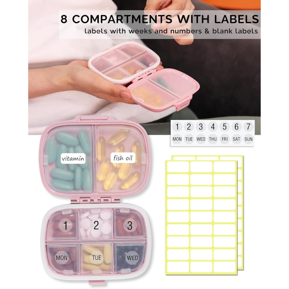 Pink 8-compartment weekly pill organizer with labeled sections (vitamin, fish oil) and day stickers for Mon–Sun, plus blank labels/stickers sheet visible in image.