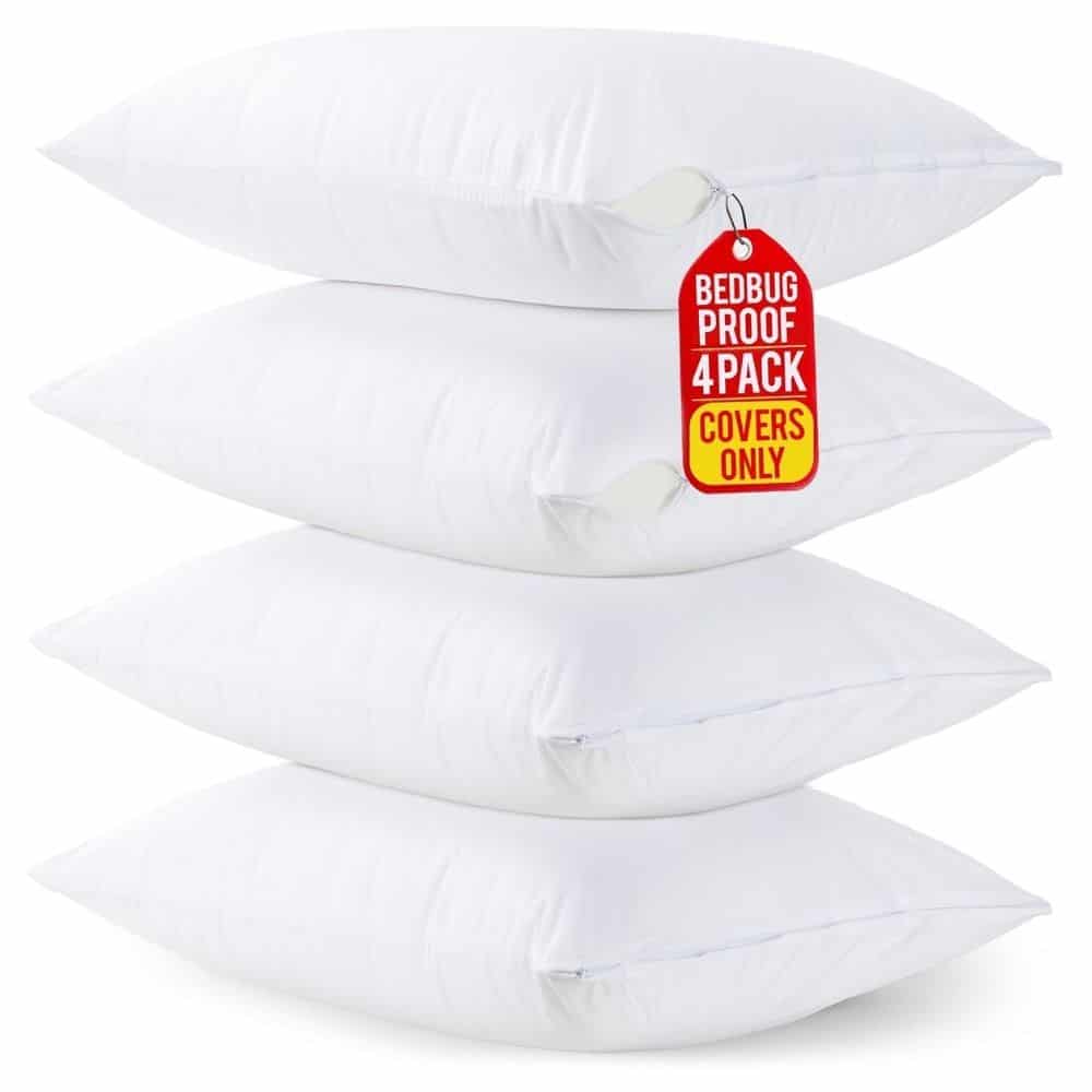 Stack of four white pillows with a red tag reading 'Bedbug Proof 4 Pack Covers Only'