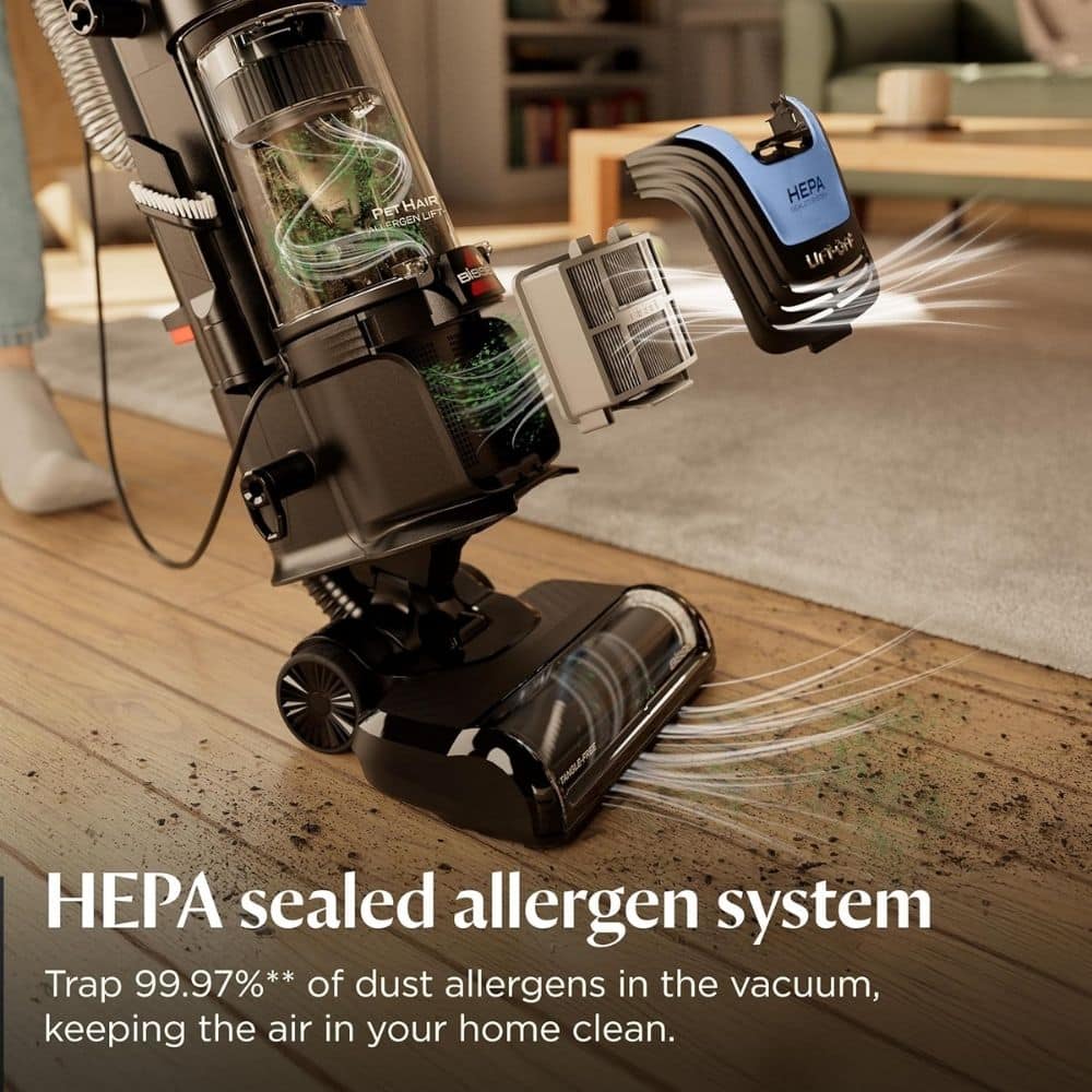 Vacuum cleaner with a HEPA sealed allergen system, showing dust being trapped as it cleans a wooden floor in a living room.