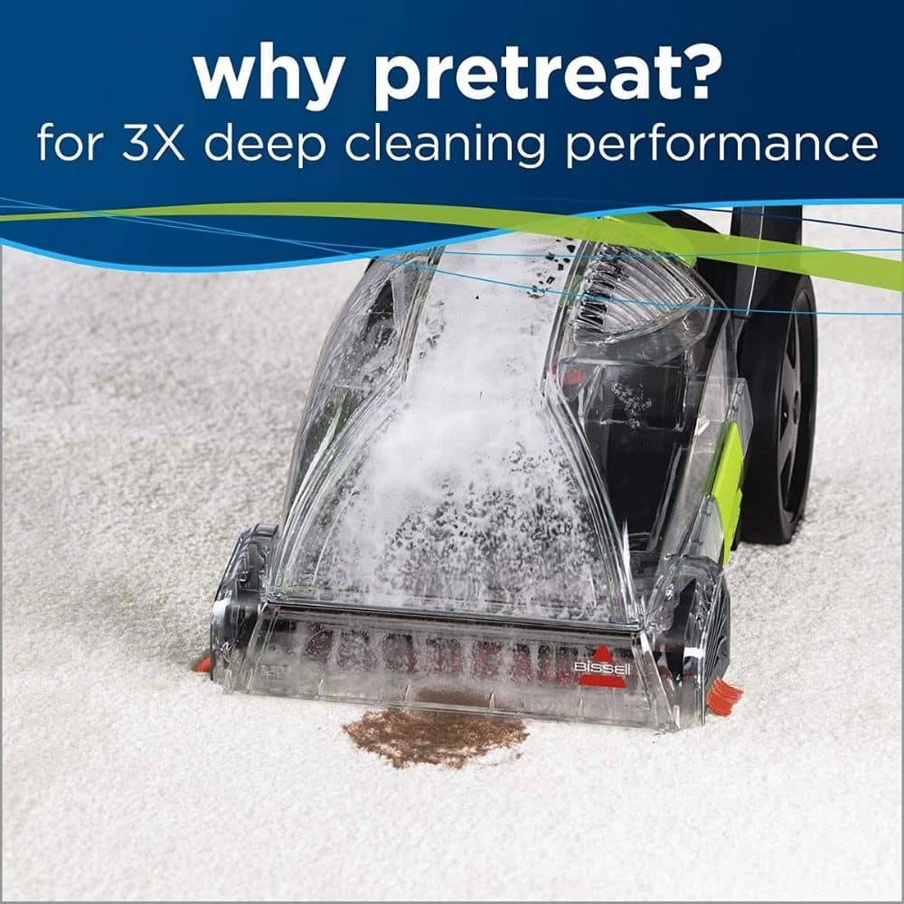 Carpet-cleaning machine pretreats a brown stain on a light carpet with an ad banner reading 'why pretreat? for 3X deep cleaning performance' at the top.