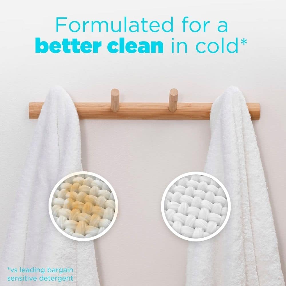 Ad comparing detergent performance on white towels; close-up weave shows stained left vs clean right, with text 'Formulated for a better clean in cold'