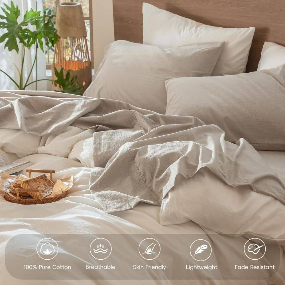 Cozy bed with neutral duvet and pillows; product icons indicate 100% cotton, breathable, skin friendly, lightweight, fade resistant.