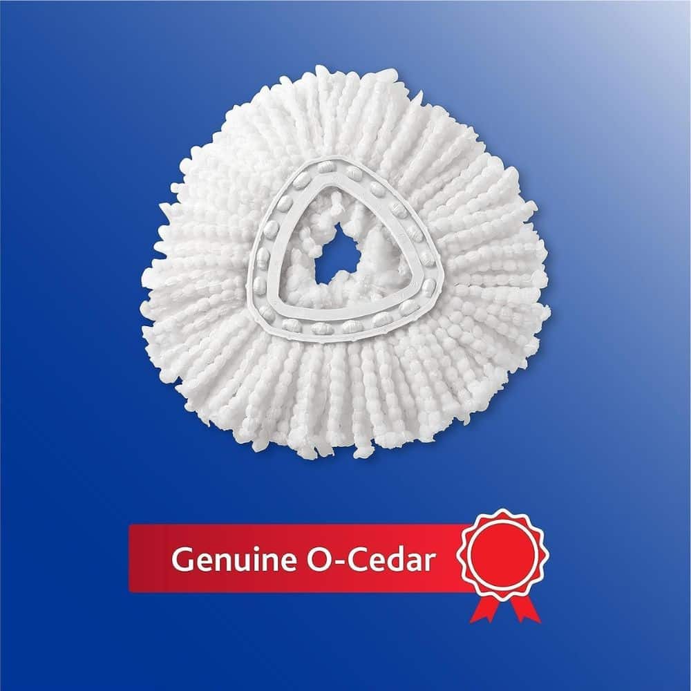 White textured circular O-Cedar mop pad displayed on a blue background with a red 'Genuine O-Cedar' banner and ribbon below.