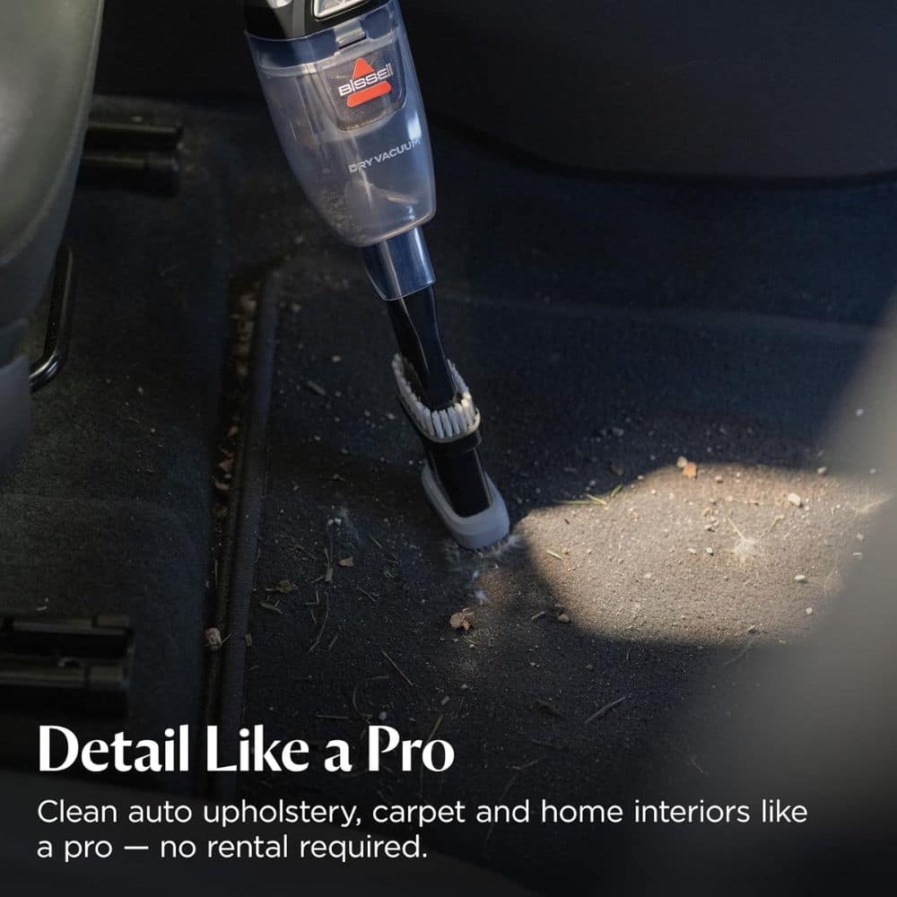Blue handheld car vacuum attachments reach the floor of a car interior; ad text reads 'Detail Like a Pro' with a promo line about upholstery cleaning.