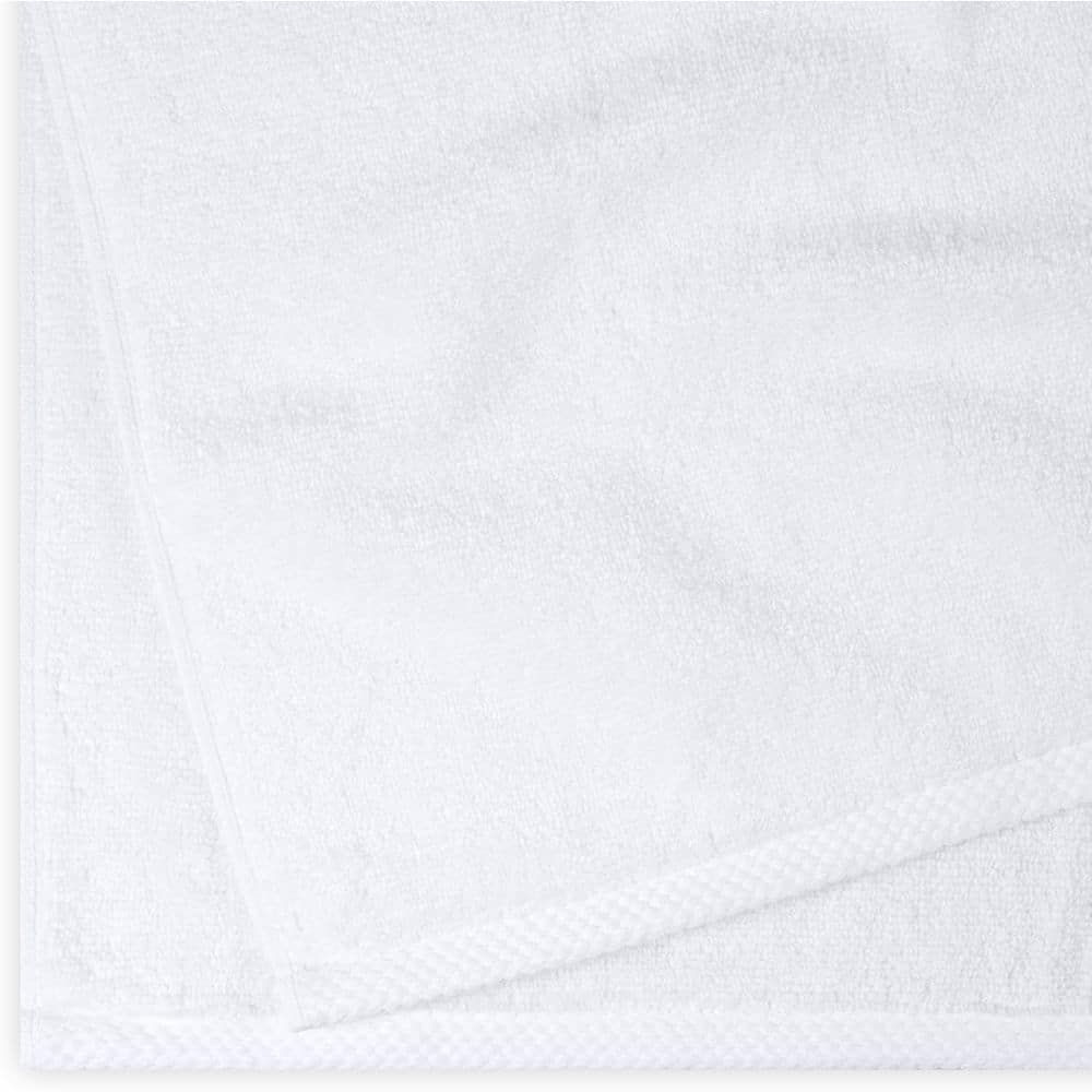 Stack of white towels folded neatly