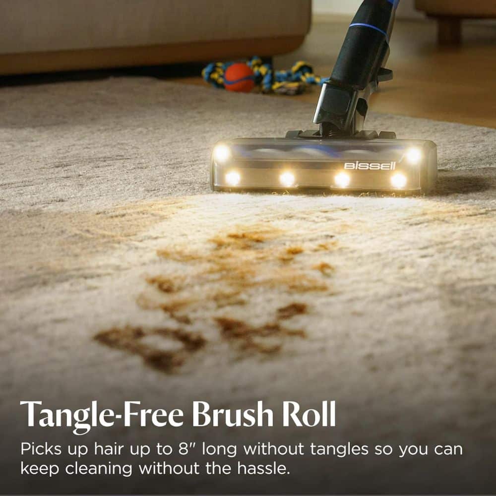 Bissell vacuum head on a carpet; overlay text reads 'Tangle-Free Brush Roll' and benefits about hair up to 8 inches without tangles.